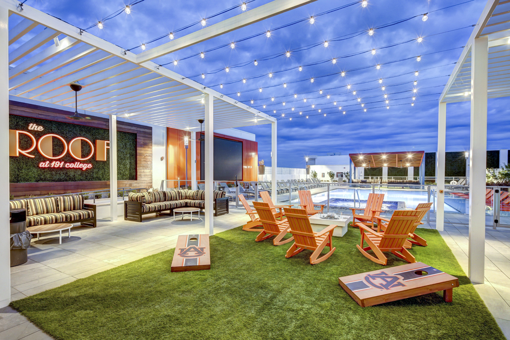 Architectural photo of 191 College pool deck sitting area at dusk